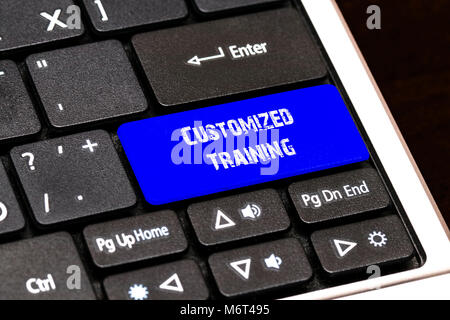 Business Concept - Blue Customized Training Button on Slim. Stock Photo