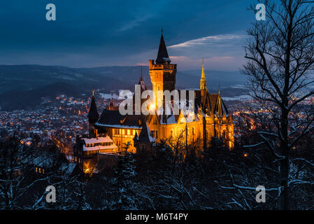 Wernigerode, Germany - February 6, 2018: Castle Wernigerode in winter with snow during dawn and view on the city of Wernigerode in Saksen-Anhalt. Stock Photo