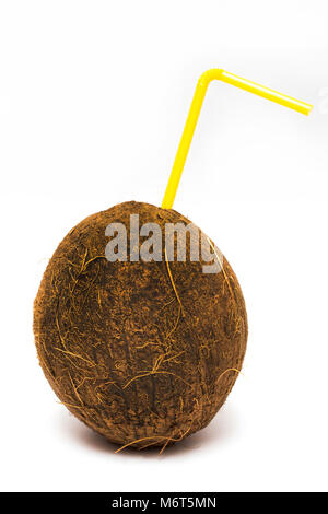 Coconut cocktail with yellow straw isolated on white. Stock Photo