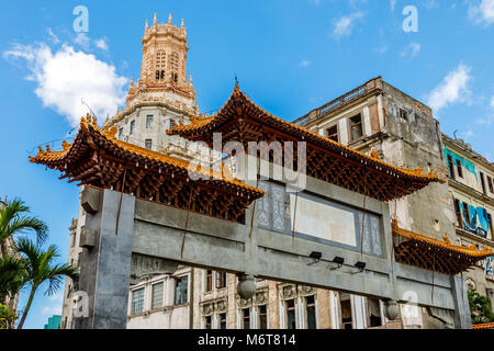 Abandoned chinatown arch and old slums in the background, Havana, Cuba Stock Photo