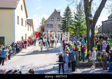 Sorbian easter riders (Osterreiter) and spectators attend the Easter procession in Radibor at Bautzen, Upper Lusatia, Saxony, Germany. Stock Photo