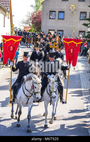 Sorbian easter riders (Osterreiter) and spectators attend the Easter procession in Radibor at Bautzen, Upper Lusatia, Saxony, Germany. Stock Photo