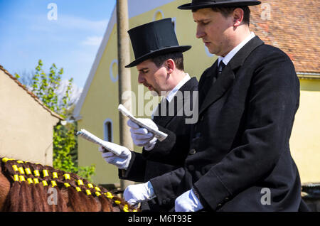 Sorbian easter riders (Osterreiter) and spectators attend the Easter procession in Radibor at Bautzen, Upper Lusatia, Saxony, Germany. Stock Photo