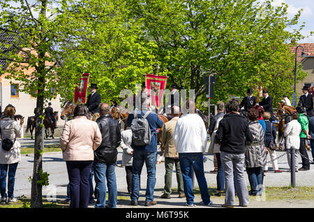 Sorbian Easter Riders (Osterreiter) and spectators attend the Easter procession in Radibor near Bautzen, Upper Lusatia, Germany. Stock Photo