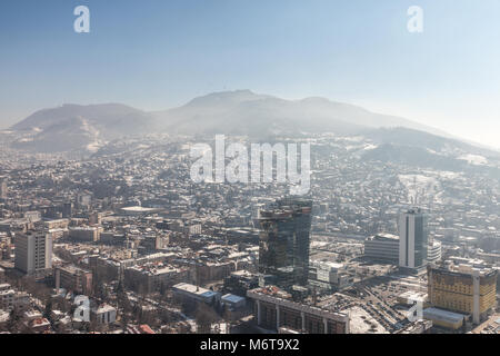 SARAJEVO, BOSNIA HERZEGOVINA - FEBRUARY 16, 2018:  Aerial Picture of the newer part of Sarajevo during a snow winter day. Unitic Towers and Holiday In Stock Photo