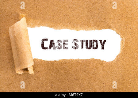 The text Case Study appearing behind torn brown paper. Stock Photo