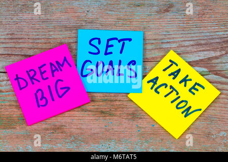 dream big, set goals, take action concept - motivational advice or reminder on colorful sticky notes on wooden background. Stock Photo