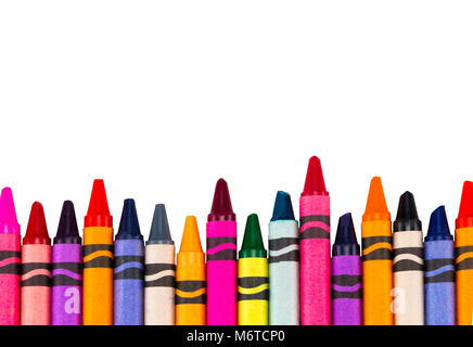 Crayons space background lined up isolated on white background with copy space. Stock Photo