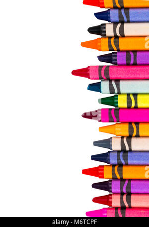 Crayons space background lined up isolated on white background with copy space. Stock Photo