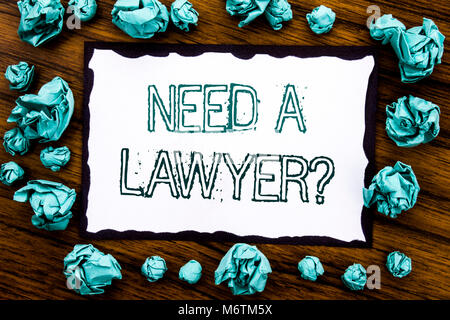 Handwriting Announcement text showing Need A Lawyer. Business concept for Advocacy Justice Help Written on sticky note paper, wooden background folded Stock Photo