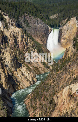 Lower Falls of the Yellowstone River, with rainbow at base of the falls, from Artists Point, Yellowstone National Park, Wyoming. Stock Photo
