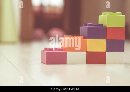 Bar chart created from toys. Conceptual image symbolizing things are on the rise, increasing, made from toys. Stock Photo
