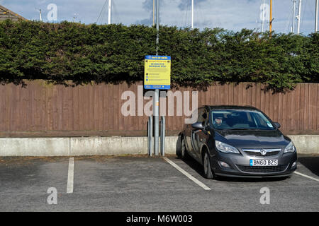 Man waiting in his car in a supermarket carpark Stock Photo