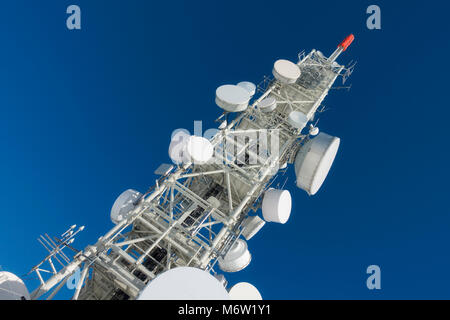 Telecommunication tower with dish antennas Stock Photo