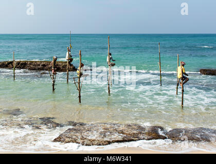 Stilt fishermen in Koggala near Galle, Sri Lanka Stock Photo