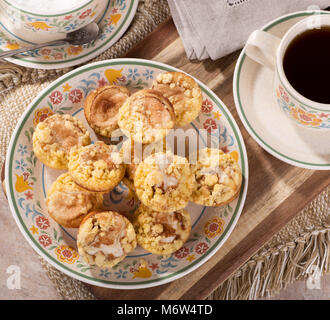 Top view of cinnamon cream cheese coffee cake on a plate with a cup of coffee Stock Photo