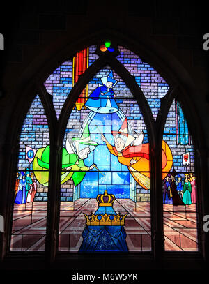 A stained glass window inside The Sleeping Beauty Castle at Disneyland of the three Fairy Godmothers from the Sleeping beauty animated Disney movie. Stock Photo