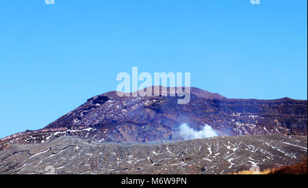 Mt. Aso volcano with the Nakadake crater spewing sulfur steam. Stock Photo