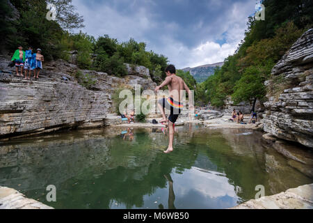 Zagori, Greece - August 20, 2017: people swim in natural small lakes in the rocks between two of the most beautiful villages in Zagori region, Megalo  Stock Photo