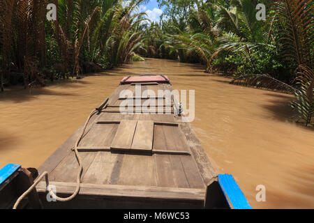 Boating on a dirty river Mekong Delta, Vietnam Stock Photo