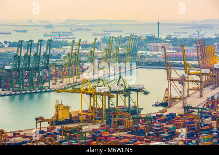 View of container terminal at the Port of Singapore. Cargo ships docked in harbor. Stock Photo