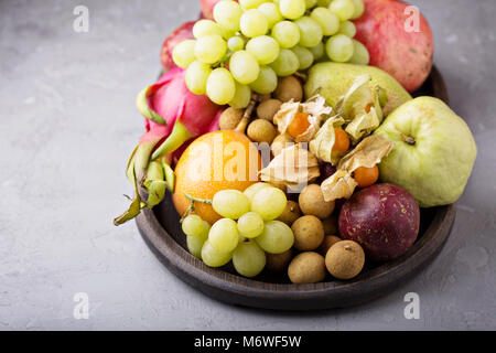 Exotic fruits platter with grapes, dragon fruit, longan and passion fruit Stock Photo