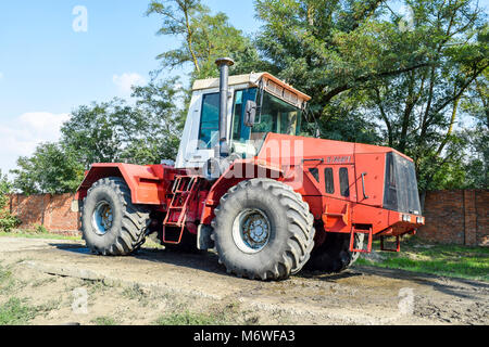 Russia, Temryuk - 15 July 2015: Big tractor. Old Soviet agricultural machinery Stock Photo