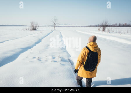 Alone traveler in yellow jacket Stock Photo