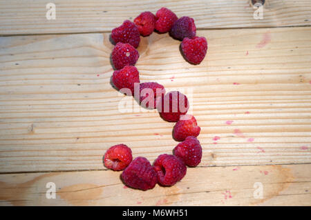 Alphabetical letters made of raspberries on a white background Stock ...