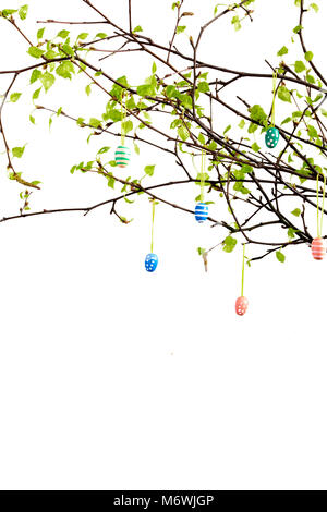 Branches of tree with hanging easter eggs isolated on white. Copy space. Stock Photo