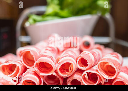 A plate of raw meat in a chinese hot pot restaurant Stock Photo