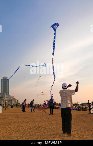 Vertical view of people kite-flying on Galle Face Green in Colombo, Sri Lanka. Stock Photo