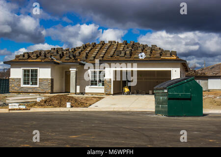 New Home Under Construction With Roofing Tiles Ready To Be Installed Stock Photo
