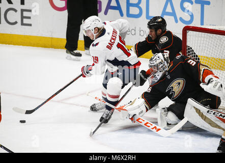 Los Angeles, California, USA. 6th Mar, 2018. Washington Capitals' forward Nicklas Backstrom (19) controls the puck as Anaheim Ducks' goalie John Gibson (36) and Anaheim Ducks' defenseman Kevin Bieksa (3) defend during a 2017-2018 NHL hockey game in Anaheim, California on March 6, 2018. The Ducks won 4-0. Credit: Ringo Chiu/ZUMA Wire/Alamy Live News Stock Photo