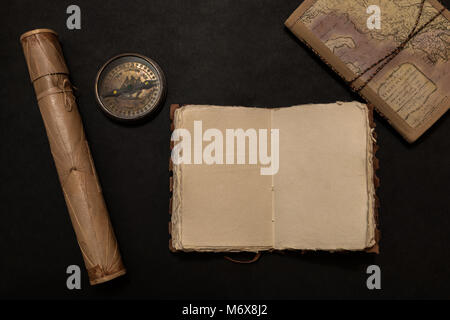 Travel notes on dark background with free space of the open book Stock Photo