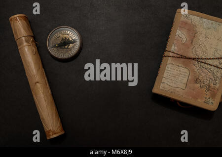 Travel notes on dark background with free space of the open book Stock Photo