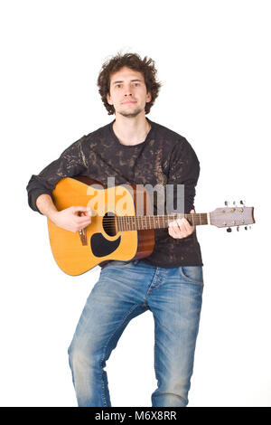 Young man wearing in black shirt and jeans playing on a gitare Stock Photo