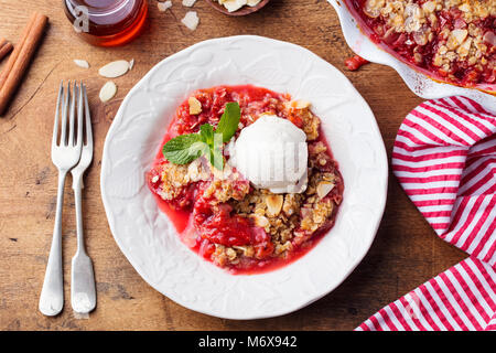 Crumble with berries, fruits. Vanilla ice cream Stock Photo