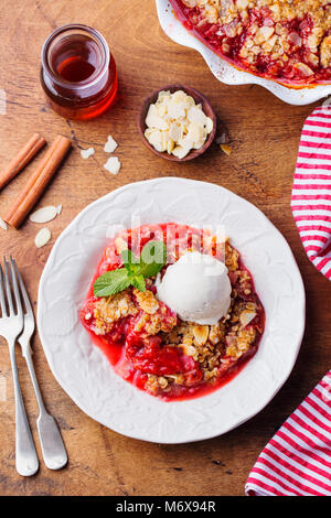 Crumble with berries, fruits. Vanilla ice cream Stock Photo