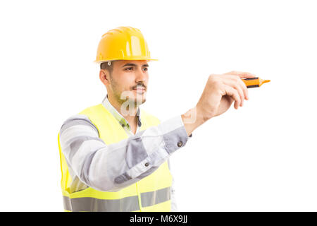 Handsome constructor holding and writing with marker pen isolated on white copyspace background Stock Photo
