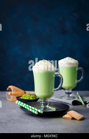 Matcha green tea latte, whipped cream. Copy space. Stock Photo