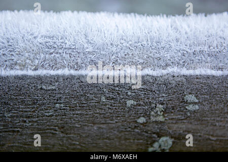 Close up of frost crystals covering a wooden post Stock Photo