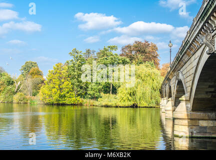 The Serpentine Bridge over the Serpentine at Hyde Park in autumn, London Stock Photo