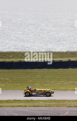 Classic sports car speeding around the Anglesey motor racing circuit, Ty Croes, Anglesey, Wales, June Stock Photo