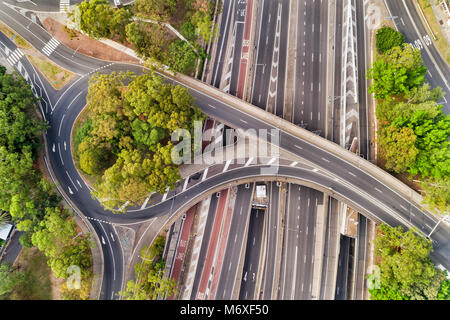 Warringah freeway at multi-level intersection of North Sydney when crossing street forms round about and a bridge at times with no traffic. Aerial vie Stock Photo