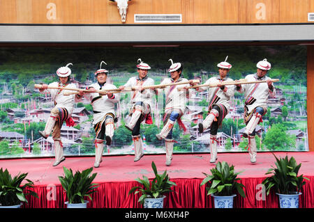 Jiuzhaigou, China - December 31, 2013 : Tibetan group performing music on stage in Jiuzhaigou national park Stock Photo