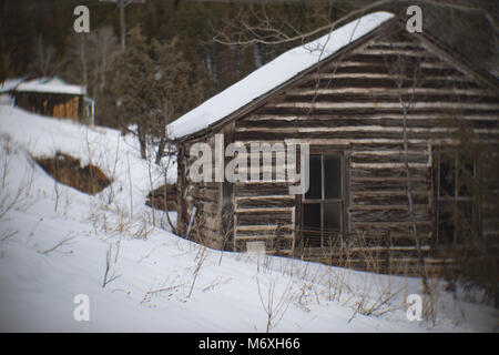 An abandoned log cabin in the ghost town of Tower, east of Philipsburg, Montana. Stock Photo