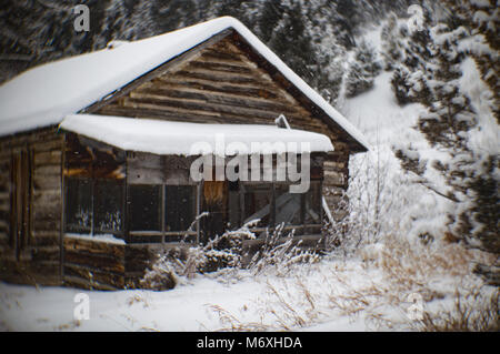 An abandoned log cabin in the ghost town of Tower, east of Philipsburg, Montana. Stock Photo