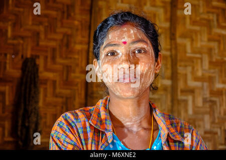 Portrait of a beautiful young woman wearing Thanaka, the yellow face paste Stock Photo