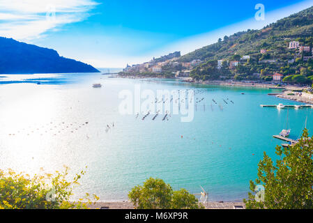 The Gulf of Poets in a sunny day with view of in the distance of the beautiful town of Porto Venere, also called Portovenere, with. Cinque Terre, Ligu Stock Photo